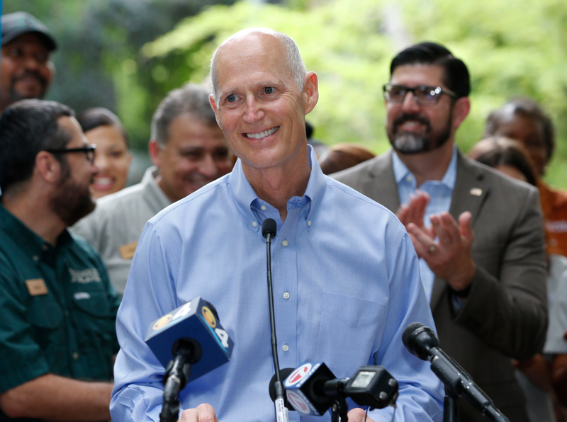 Florida Gov. Rick Scott smiles as he speaks during a news conference at Jungle Island zoological park, Tuesday, June 13, 2017, in Miami. AP images